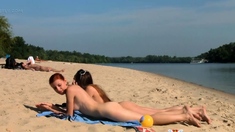 Petite nudist teen enjoys a beautiful day at the beach