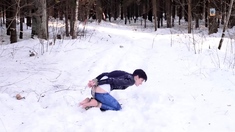 Barefoot Claudia is captured in the cold winter forest