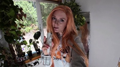 Glamourous redhead toys ass solo