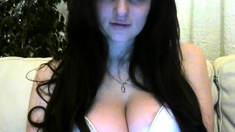 Busty curly brunette with big boobs fucks on couch